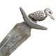 This bookmark was made in Austrailia by Prond. It is marked STG 935 for sterling. The to is a figural bird, possibly a woodpecker sitting on a boomarang. The date is 1950 - 1970.